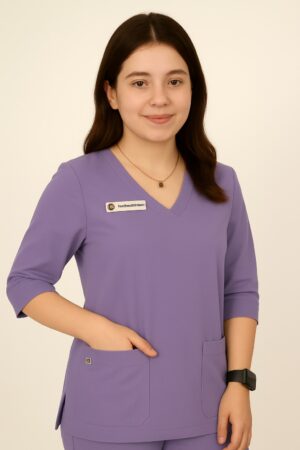 Basic women's scrub suit in light color featuring V-neckline top, quarter sleeves, and pajama-style trousers, designed for medical professionals.Comfortable & Affordable OT Wear