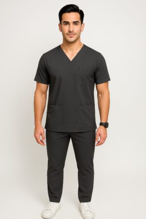 Male model wearing slim fit navy medical scrub suit with V-neck top and matching tapered pants.