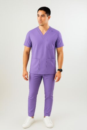 Male model wearing slim fit navy medical scrub suit with V-neck top and matching tapered pants.
