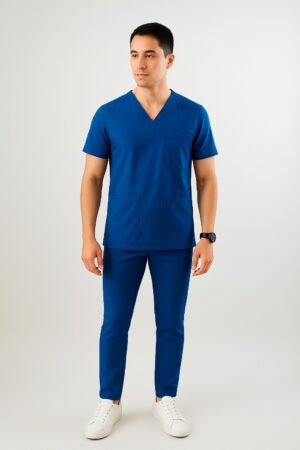 Male model wearing slim fit navy medical scrub suit with V-neck top and matching tapered pants.