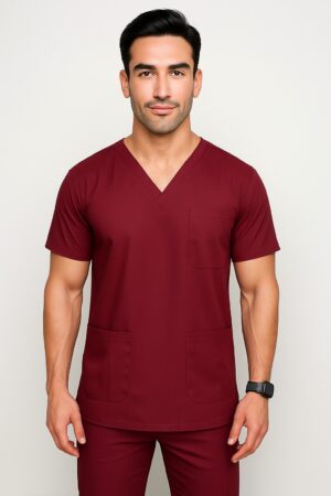 Affordable high-quality Prince men’s scrub in navy blue with V-neck and multiple pockets, modeled by a male doctor, ideal for medical professionals in Pakistan. Men's Scrub in Pakistan